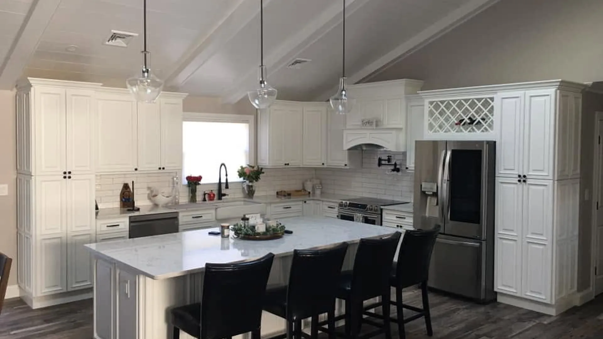Kitchen remodel by North South Construction — vaulted ceiling, pendant lighting and large island